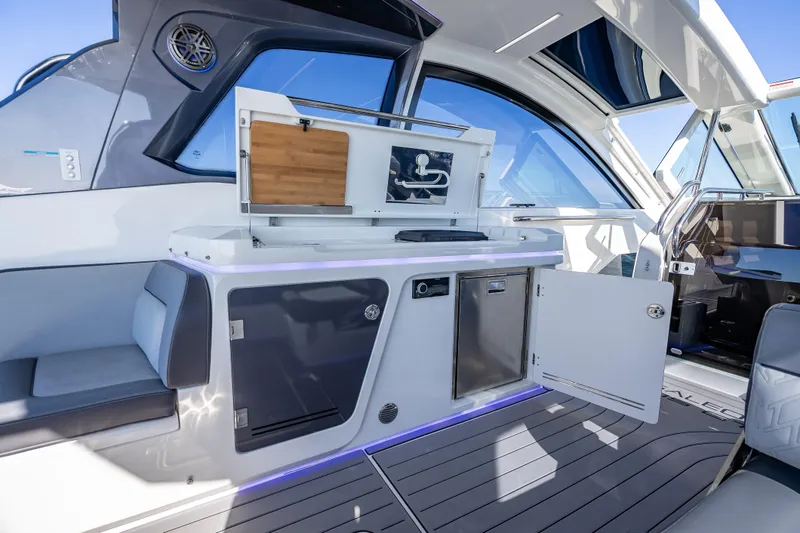 Slide: The Image of 2023 Galeon 375 GTO yacht interior with modern kitchenette and seating area. - 34