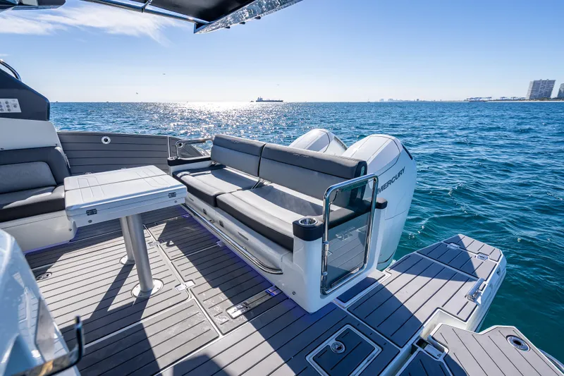 Slide: The Image of 2023 Galeon 375 GTO luxury yacht deck with seating, table, and ocean view. - 35