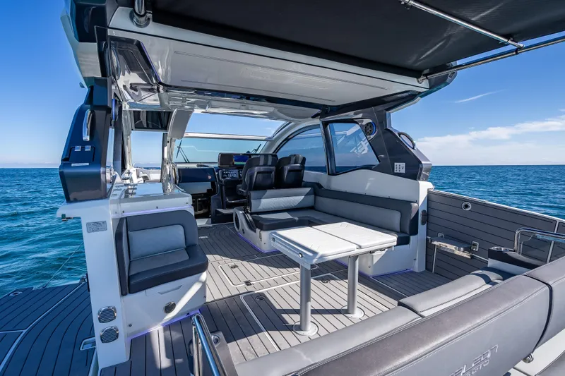 Slide: The Image of 2023 Galeon 375 GTO luxury yacht interior with sleek seating and ocean view. - 36