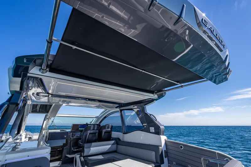 Slide: The Image of 2023 Galeon 375 GTO yacht interior with open canopy, ocean view. - 37