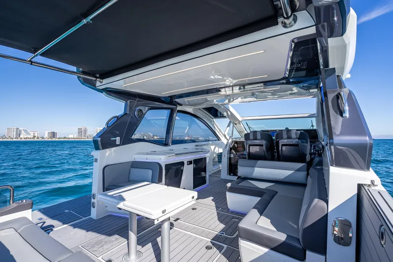 Slide: The Image of Luxurious 2023 Galeon 375 GTO yacht interior with sleek seating and ocean view. - 38