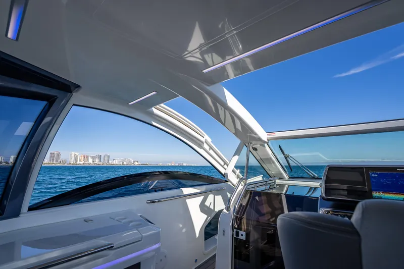 Slide: The Image of Interior view of 2023 Galeon 375 GTO yacht with ocean and city skyline. - 40