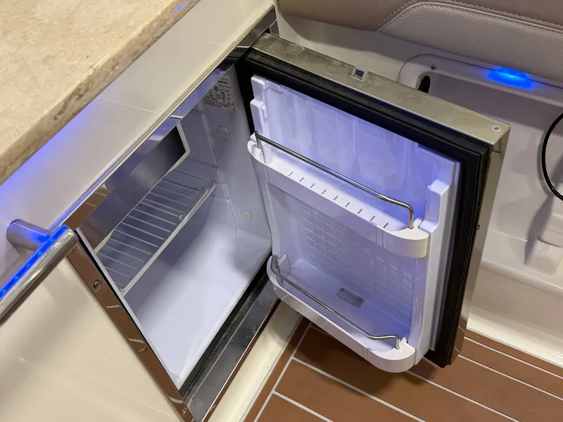 Slide: The Image of 2019 Sailfish 275 DC boat cruising on a scenic river. - 34