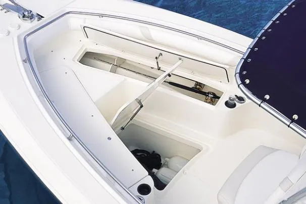 Slide: The Image of Twin Mercury Verado engines on a 2008 Boston Whaler 270 Outrage, under a clear blue sky. - 4