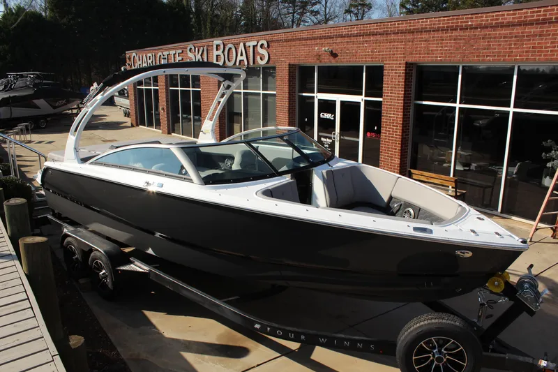 The Image of 2026 Four Winns H4 boat on trailer at Charlotte Ski Boats dealership. - 0