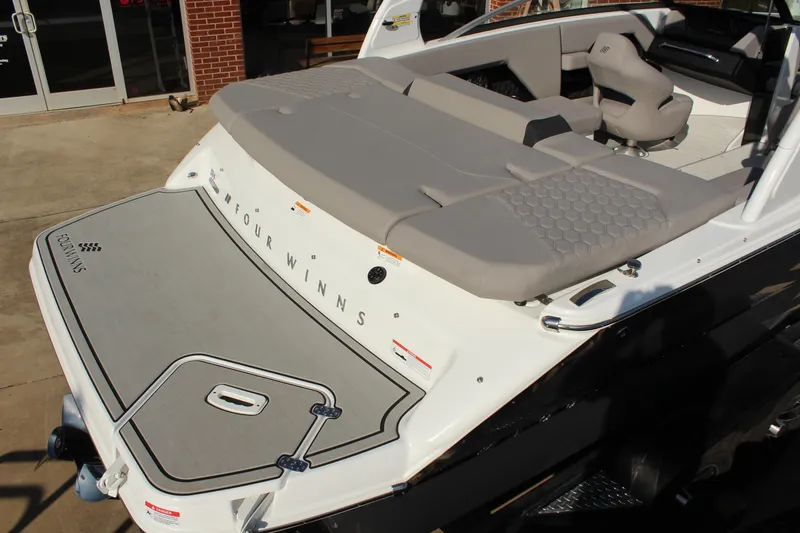 Slide: The Image of 2026 Four Winns H4 boat with spacious seating and sleek design. - 11