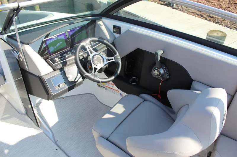 Slide: The Image of 2026 Four Winns H4 boat cockpit with modern steering and control panel. - 13