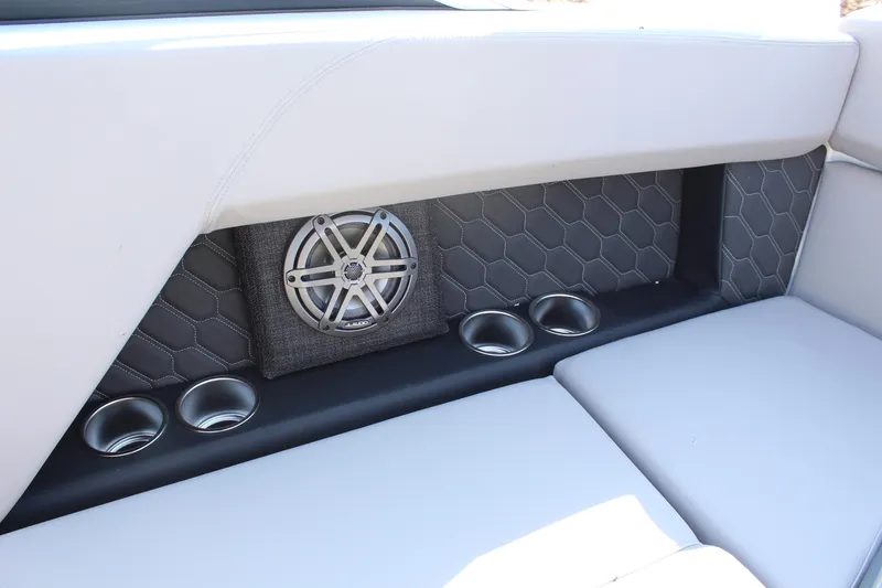 Slide: The Image of 2026 Four Winns H4 boat interior with speaker and cup holders. - 16