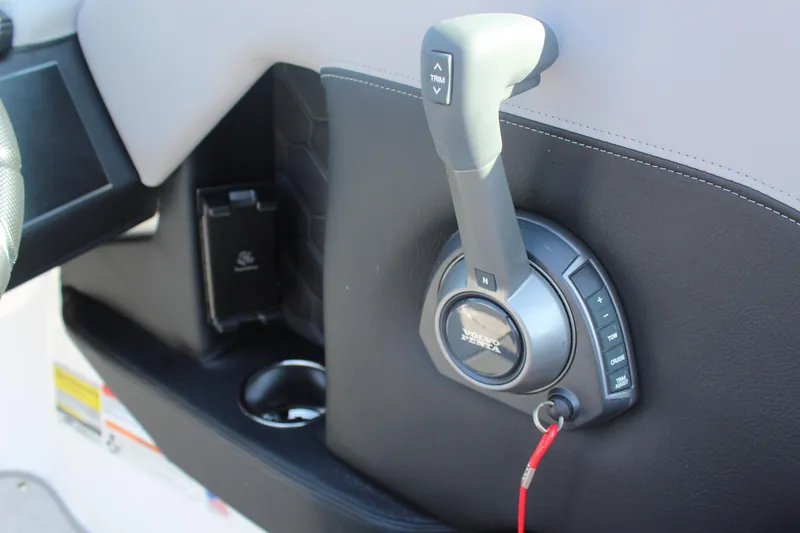 Slide: The Image of 2026 Four Winns H4 boat throttle control with trim and cruise buttons. - 19