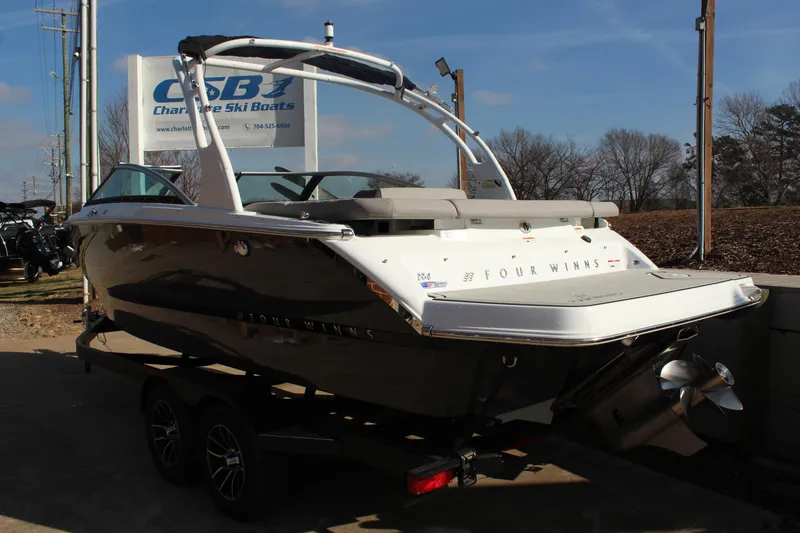 Slide: The Image of 2026 Four Winns H4 boat on trailer at Charlotte Ski Boats dealership. - 27
