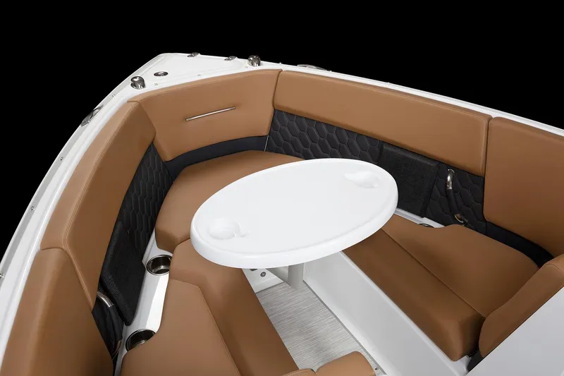 Slide: The Image of Manufacturer Provided Image: 2025 Four Winns H4 boat interior with brown seating and a white table. - 34