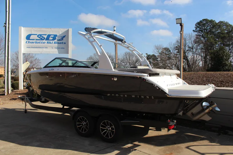 Slide: The Image of 2026 Four Winns H4 boat on trailer at Charlotte Ski Boats dealership. - 6