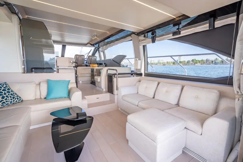 Slide: The Image of Luxurious interior of 2019 Azimut 66 yacht with elegant seating and panoramic windows. - 100
