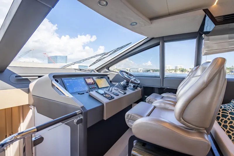 Slide: The Image of Luxurious 2019 Azimut 66 yacht cockpit with modern navigation controls and plush seating. - 102