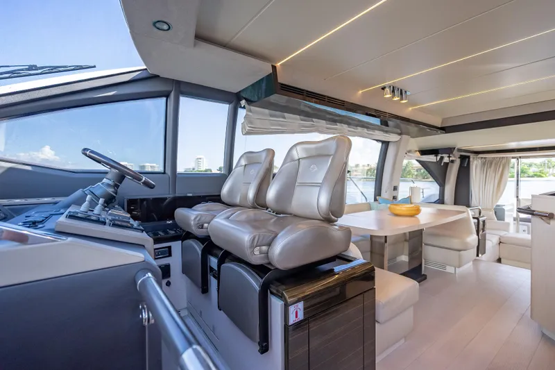 Slide: The Image of Luxurious interior of 2019 Azimut 66 yacht with modern seating and dining area. - 104