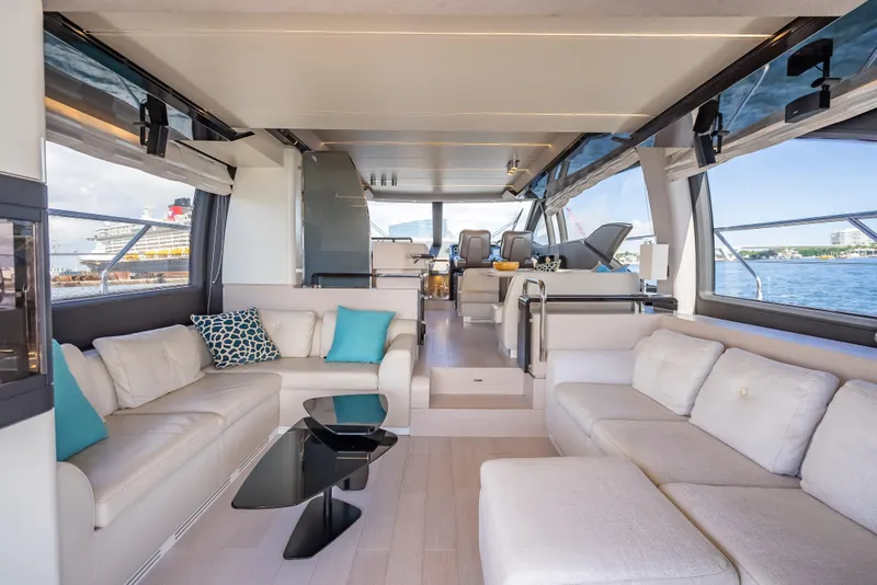 Slide: The Image of Luxurious interior of 2019 Azimut 66 yacht with elegant seating and panoramic windows. - 105