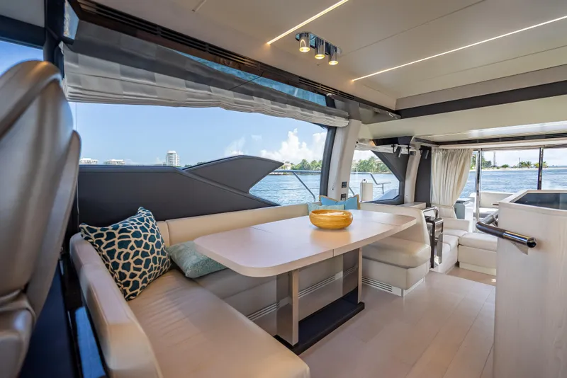 Slide: The Image of Luxurious interior of 2019 Azimut 66 yacht with elegant dining area and scenic water views. - 111