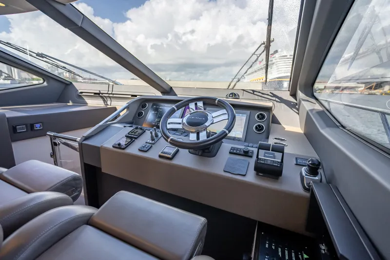 Slide: The Image of 2019 Azimut 66 yacht helm with modern controls and panoramic view. - 120