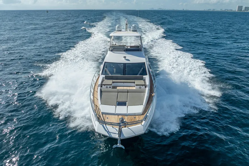 Slide: The Image of 2019 Azimut 66 yacht cruising on open ocean waters. - 24