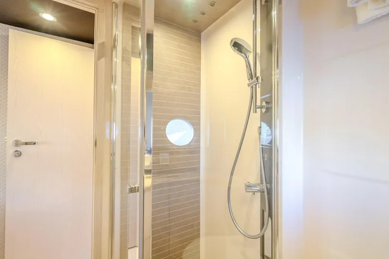Slide: The Image of Luxurious shower area in 2019 Azimut 66 yacht, featuring modern fixtures and elegant design. - 44