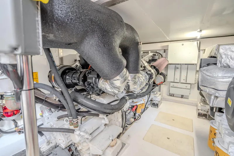 Slide: The Image of Engine room of a 2019 Azimut 66 yacht, showcasing complex machinery and components. - 55