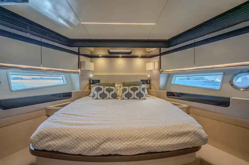 Slide: The Image of Luxurious bedroom interior of 2019 Azimut 66 yacht with modern design and elegant bedding. - 66