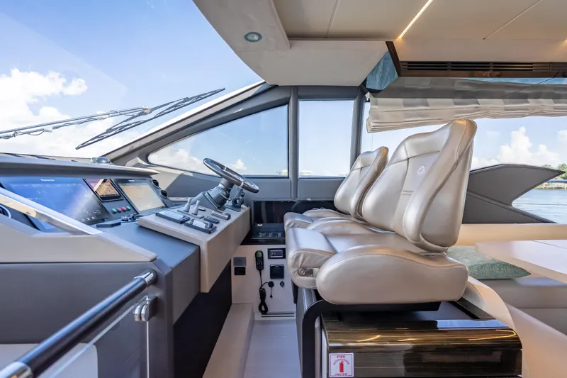 Slide: The Image of Luxurious interior of 2019 Azimut 66 yacht with modern helm and leather seating. - 75