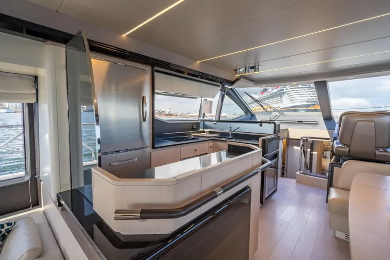 Slide: The Image of Luxurious interior of 2019 Azimut 66 yacht with modern kitchen and panoramic windows. - 98