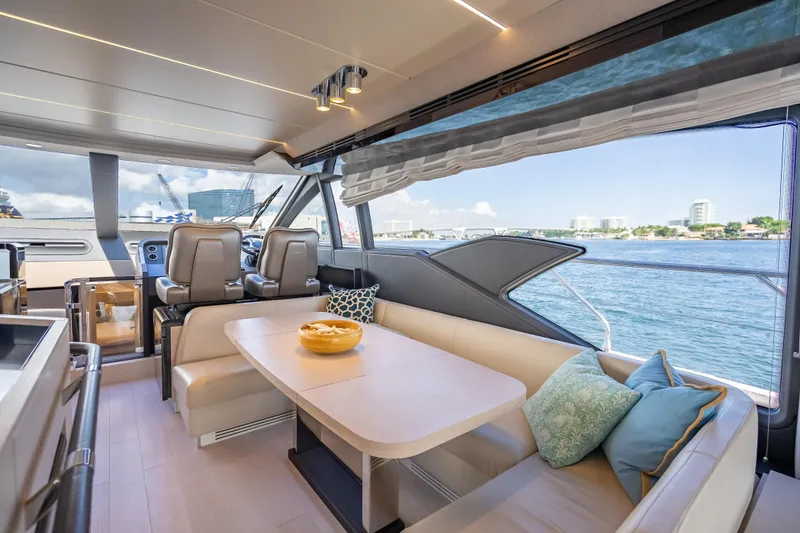 Slide: The Image of Luxurious interior of 2019 Azimut 66 yacht with elegant seating and scenic ocean view. - 99