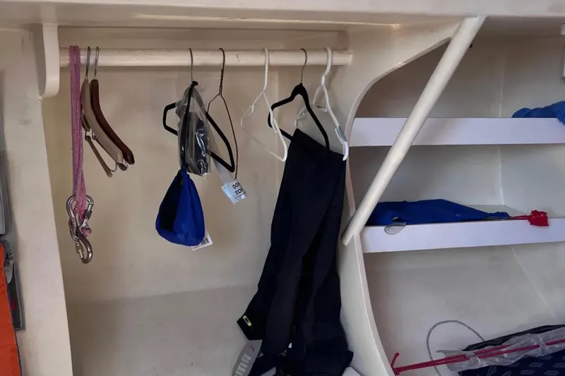 Slide: The Image of Interior of 2009 Class 40 Open Antrim Design yacht with hanging clothes and storage shelves. - 30