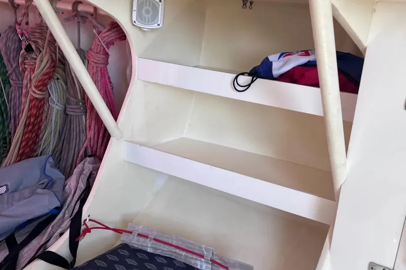 Slide: The Image of Interior of 2009 Class 40 Open Antrim Design sailboat with ropes and storage shelves. - 31