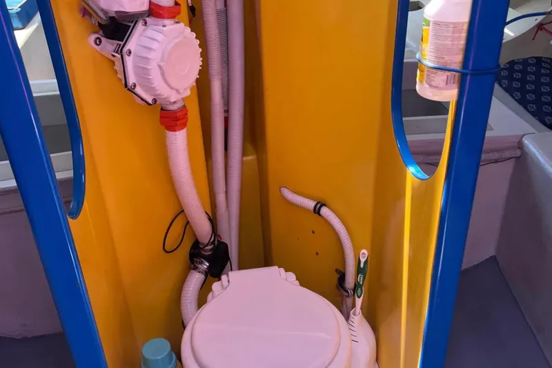 Slide: The Image of Yellow and blue boat bathroom with plumbing, 2009 Class 40 Open Antrim Design. - 32