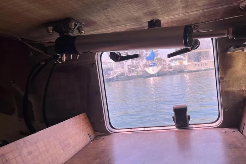 Slide: The Image of Interior view of a 2009 Class 40 Open Antrim Design sailboat, showing a window and equipment. - 42