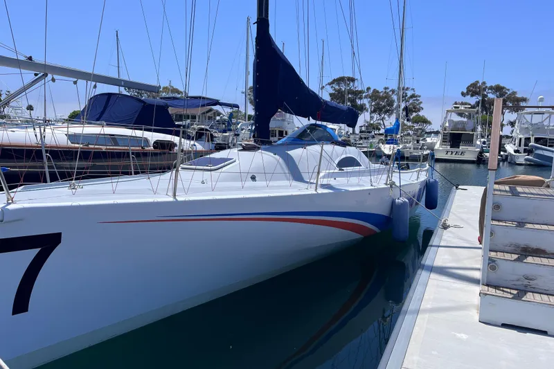 Slide: The Image of 2009 Class 40 Open Antrim Design sailboat docked in marina, clear blue sky. - 5