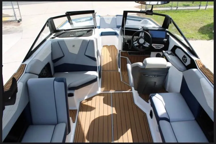 Slide: The Image of 2022 Nautique Super Air Nautique S23 interior with sleek seating and modern dashboard design. - 10
