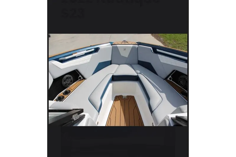 Slide: The Image of 2022 Nautique Super Air Nautique S23 boat interior with sleek seating and modern design. - 3