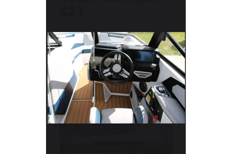 Slide: The Image of Interior view of 2022 Nautique Super Air Nautique S23 boat cockpit. - 5
