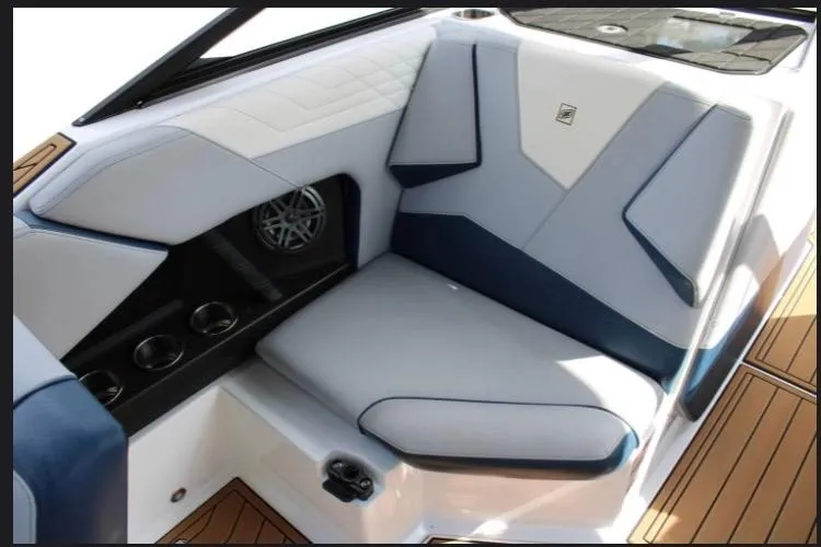 Slide: The Image of 2022 Nautique Super Air Nautique S23 interior with sleek seating and modern design. - 8