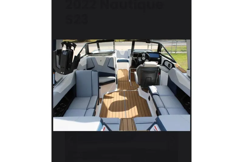 Slide: The Image of Interior of 2022 Nautique Super Air Nautique S23 boat with luxurious seating and modern design. - 9
