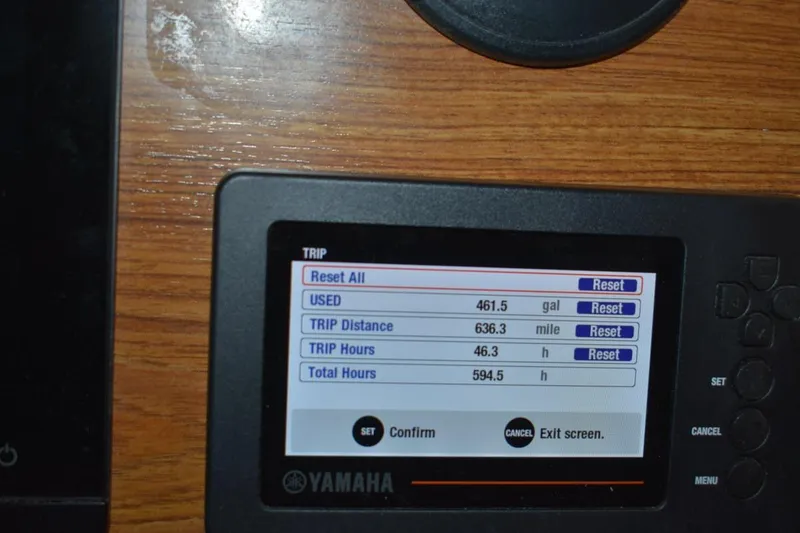 Slide: The Image of Yamaha display on 2022 Ranger Tugs R-27 showing trip data: fuel, distance, hours. - 36