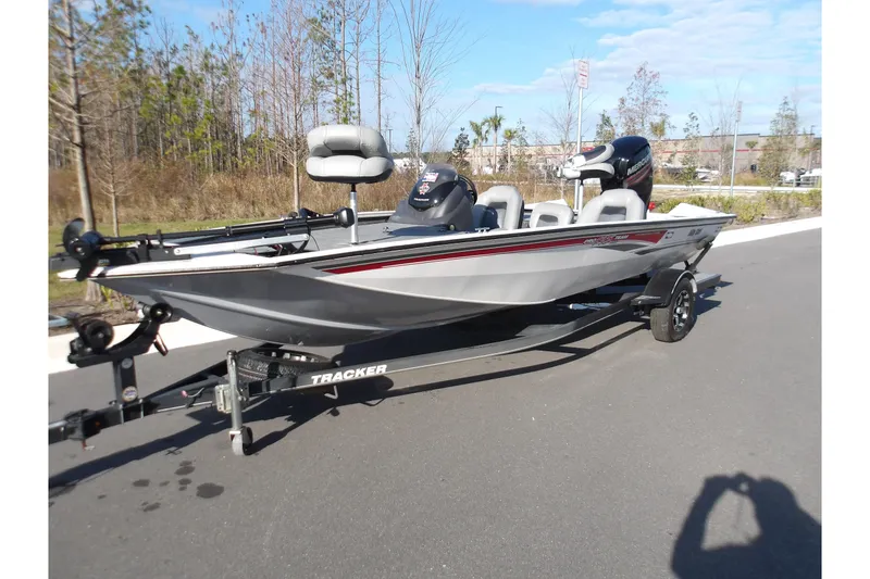 The Image of 2018 Tracker Pro Team 195 boat on trailer, parked outdoors on a sunny day. - 0