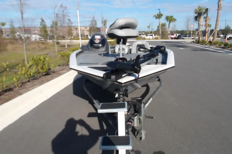 Slide: The Image of 2018 Tracker Pro Team 195 boat on trailer, parked on a sunny day. - 3