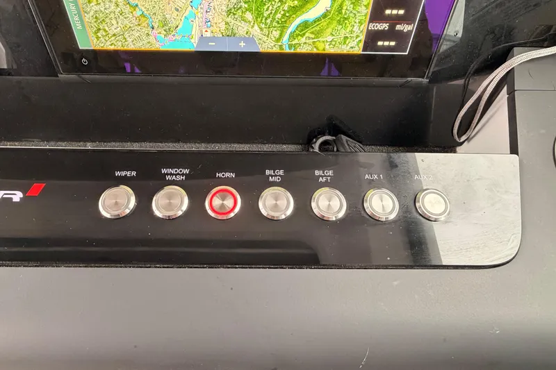 Slide: The Image of Control panel of a 2021 Axopar 37 XC Cross Cabin with various function buttons. - 18