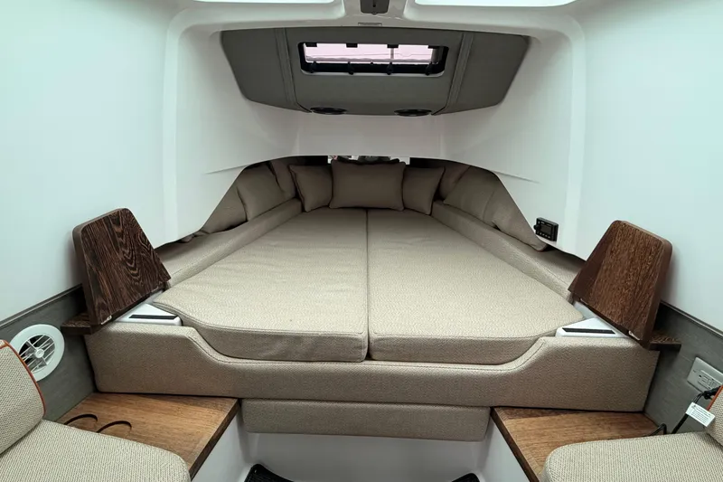 Slide: The Image of 2021 Axopar 37 XC Cross Cabin interior with cozy sleeping area and modern design. - 23
