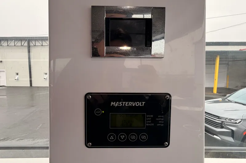 Slide: The Image of Control panel of a 2021 Axopar 37 XC Cross Cabin boat with Mastervolt display. - 29