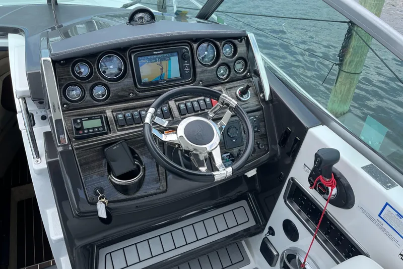 Slide: The Image of Cockpit of 2016 Monterey 295 Sport Yacht with navigation system and controls. - 4