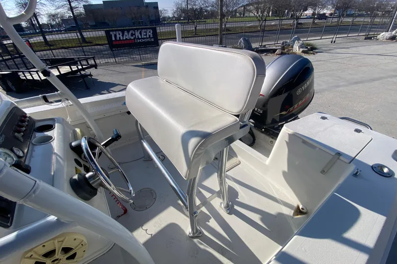 Slide: The Image of 1996 Pro-Line 170 Center Console boat interior with steering wheel and Yamaha outboard motor. - 12