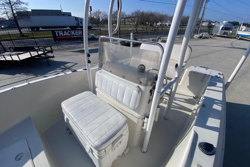 Slide: The Image of 1996 Pro-Line 170 Center Console boat interior with seating and console view. - 16