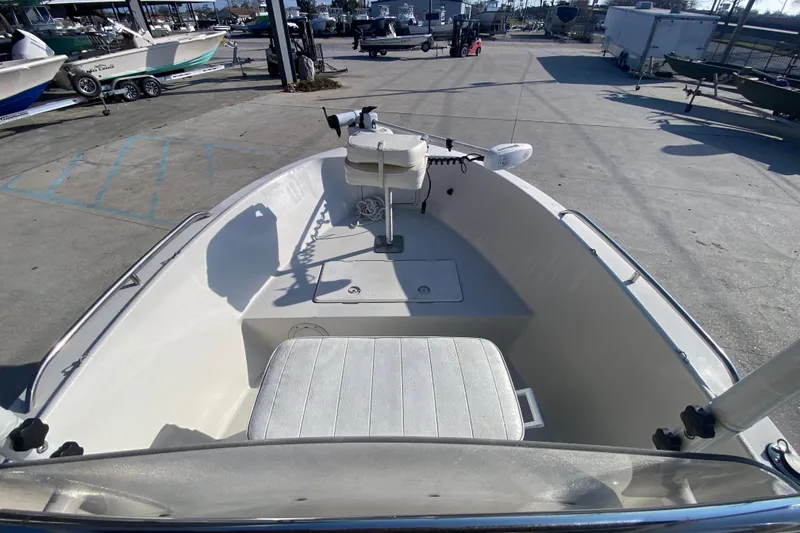 Slide: The Image of 1996 Pro-Line 170 Center Console boat interior view at a marina. - 18