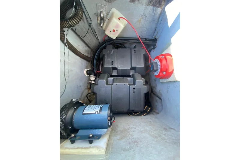 Slide: The Image of 1996 Pro-Line 170 Center Console boat battery compartment with wiring and components. - 20